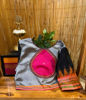 Grey. Pink. Black. With a spark of orange.