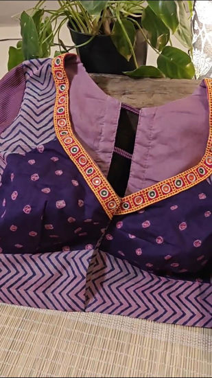 Purple. Bandhani. Mirrors.